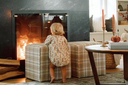 toddler in front of fireplace